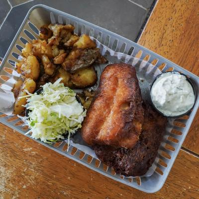 Crispy fried fish with smashed potatoes, tartare sauce, and colesalw.