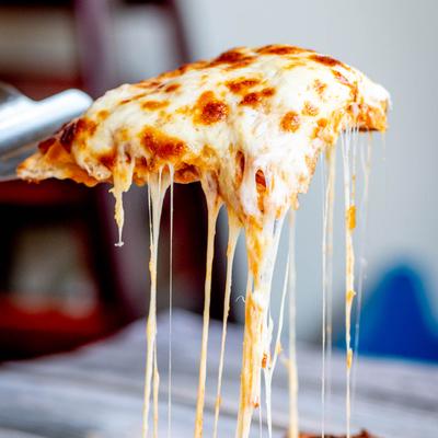 Chicken Parmesan Calzone, cheese pull shot.
