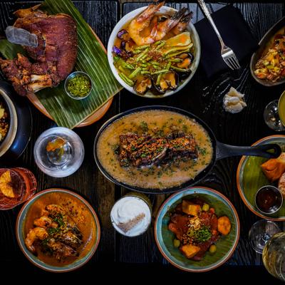 Overhead view of shared plates and entrees.