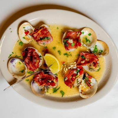 Baked clams, with prosciutto, roasted red peppers, basil, garlic, and white wine.