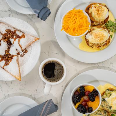 A top view of coffee and meals.