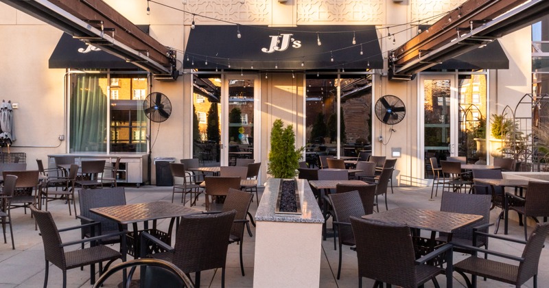 Exterior, cover patio, tables and seats, sign on the wall