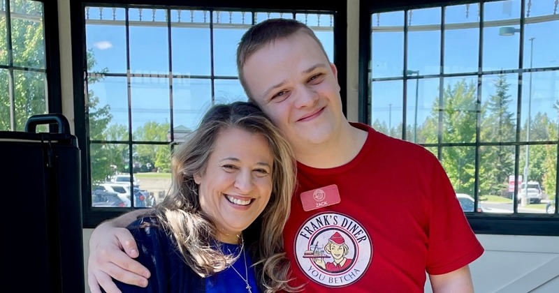 Two Staff members posing inside the restaurant