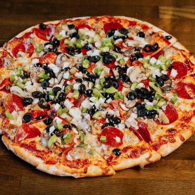 Supreme pizza topped with pepperoni, mushrooms, olives, peppers, and chopped onions.