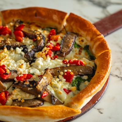 Portobello Mushroom Pizza with roasted red pepper, spinach, feta and mozzarella.
