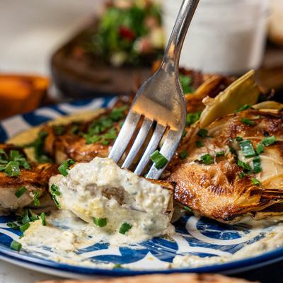 Roasted Artichoke hearts served with lemon caper aioli sauce.