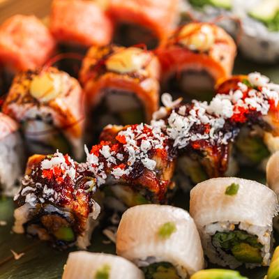 A close up of sushi on Sensational Package Sushi Boat.