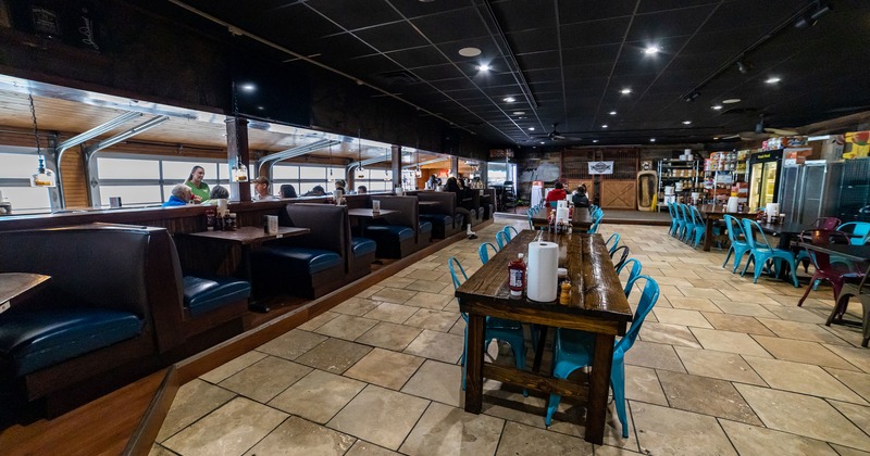 Interior, dining area, tables, chairs and lined-up booths