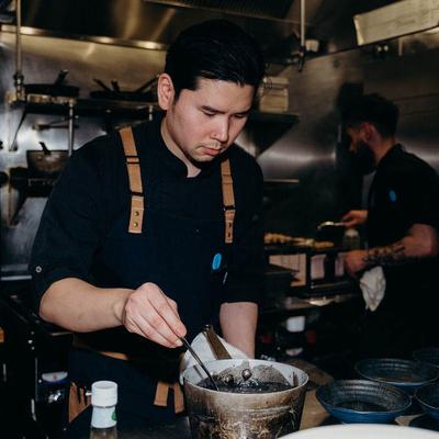 Chef stirring a pot.