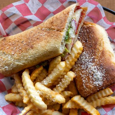 Toasted Italian sub sandwich served with crinkle-cut fries.