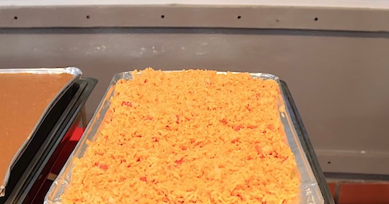 Mexican rice and refired beans in catering trays