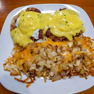 Irish Eggs Benedict served with hash browns.