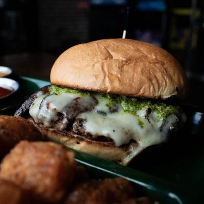 Burger with mushrooms, cheese and pesto.
