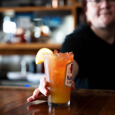 Bartender serving a cocktail.