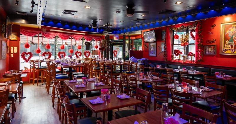 Spacious and romantic decorated interior dining area with set tables