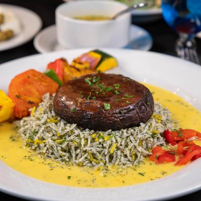 Roasted whole portobello mushroom, with dill rice, and veggies.