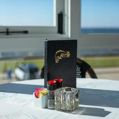 cocktail menu on porch.