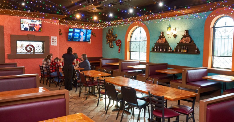 Interior, tables, chairs and benches with leather cushion and back lined up