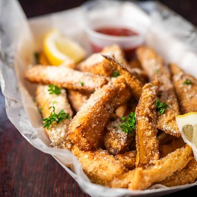 Crispy breaded eggplant sticks, close-up.