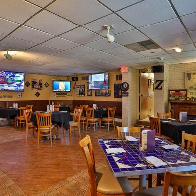 Seating area, tables ready for guests.