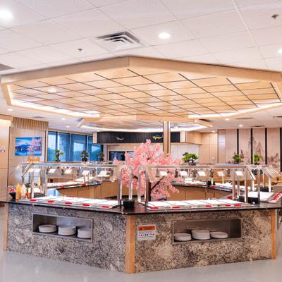 Buffet counter decorated with pink flowering branches.