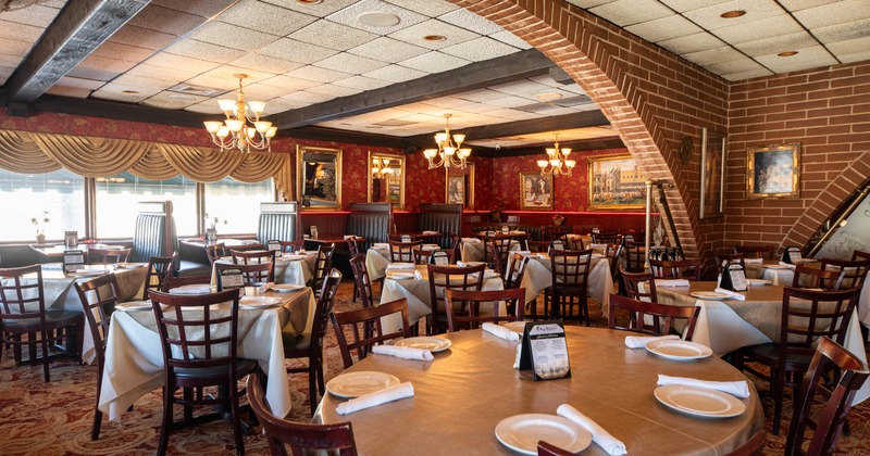 Inside, dining tables ready for guests, booths