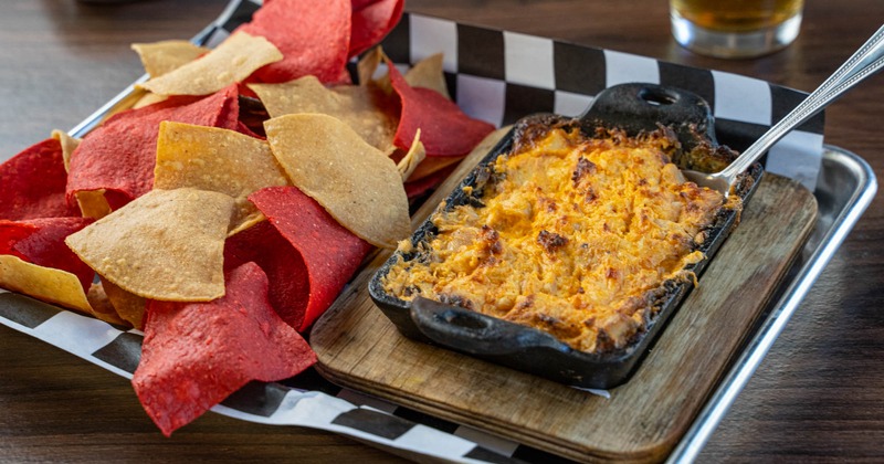 Buffalo chicken dip with tri-color tortilla chips