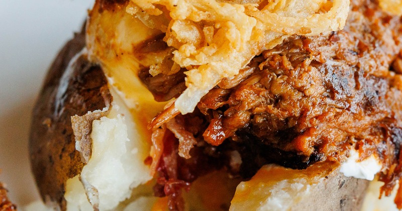 Southern Spud topped with crispy fried onions, close-up