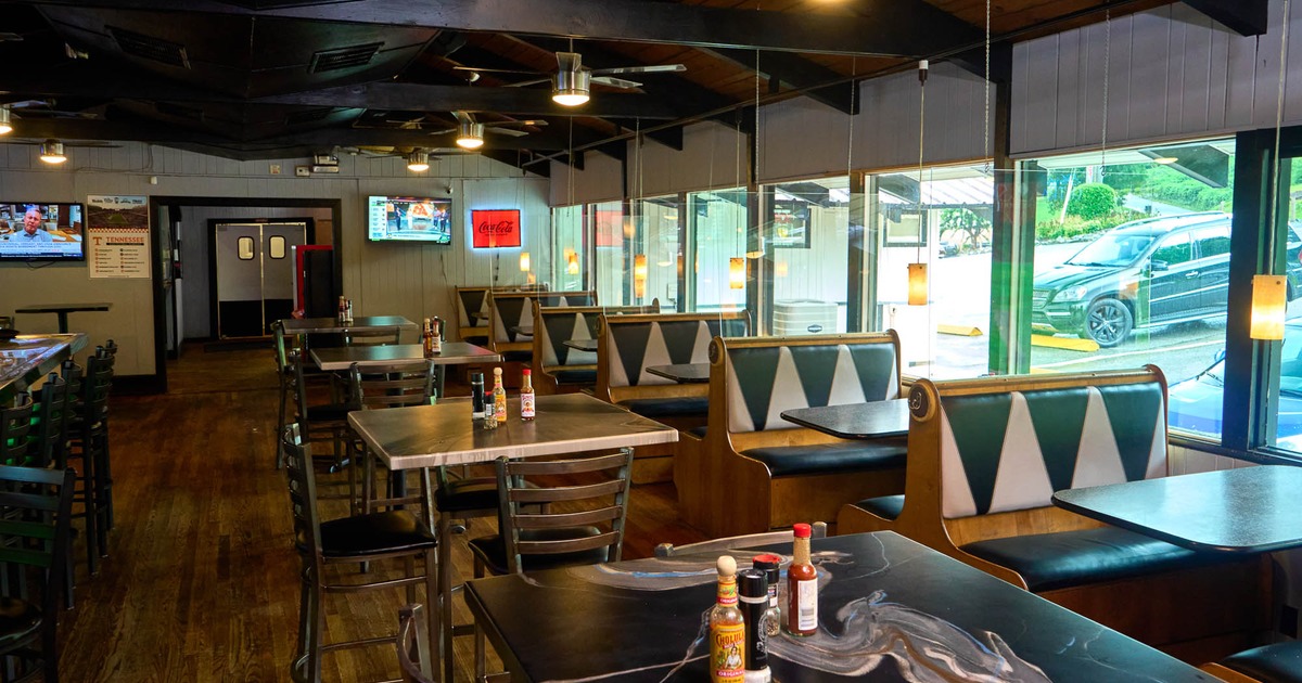 Interior, dining area with tables, chairs and restaurant booths
