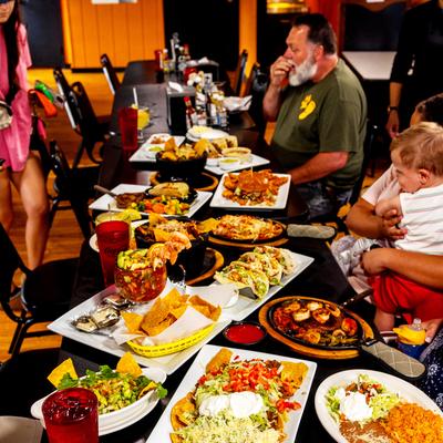 Guests sitting at a fully served table.