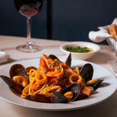 Spicy seafood pasta with calamari, mussels, and shrimp.