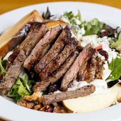 The Sulky Steak Salad drizzled with a blue cheese dressing.