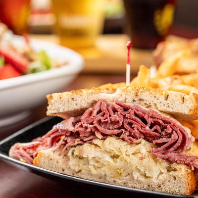 Reuben sandwich with corned beef and sauerkraut.