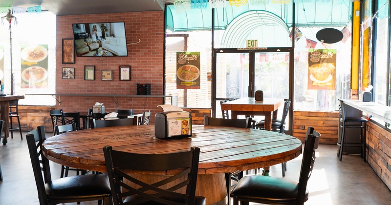 Interior, tables and chairs in seating area