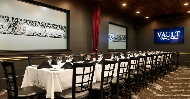 Interior, tables set for guests in dining area