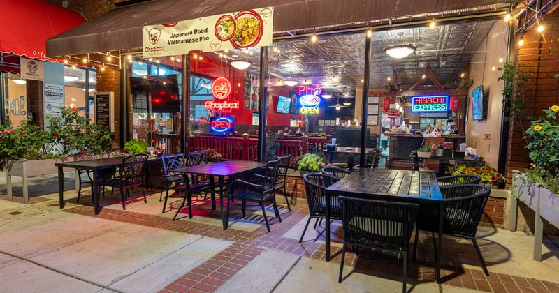 Outdoor, seating, neon signs in the window
