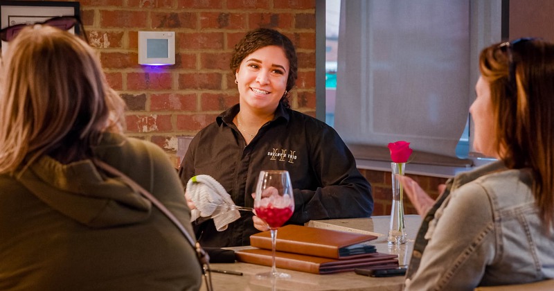 A staffer interacting with guests