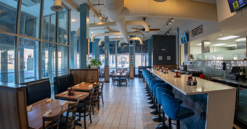 Interior, seating area with a bar on the right