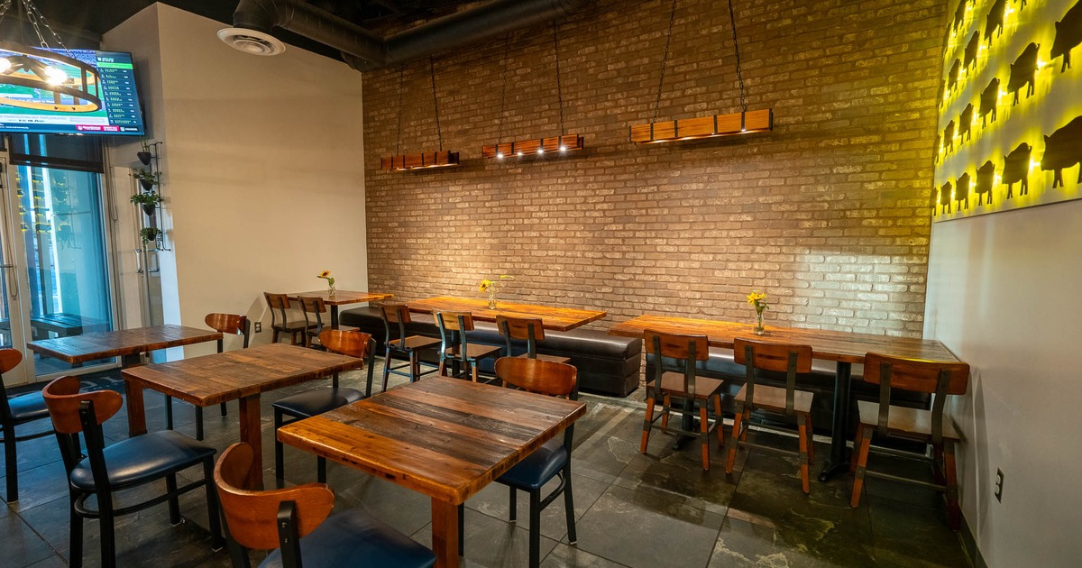 Interior, wooden tables and chairs in seating area