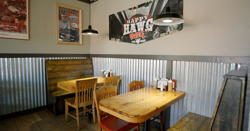 Interior space, dining area, wooden booth seating and tables ready for guests