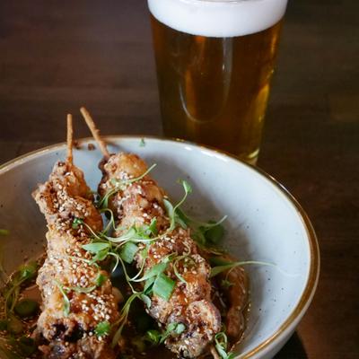 Deep fried chicken skewers with sesame.