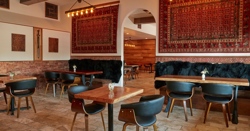 Restaurant interior, seating area, wall hanging rugs