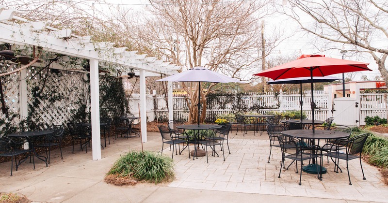 Patio, tables and chairs with parasols