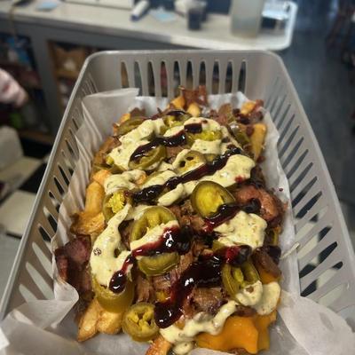 Beef brisket loaded fries with jalapenos.