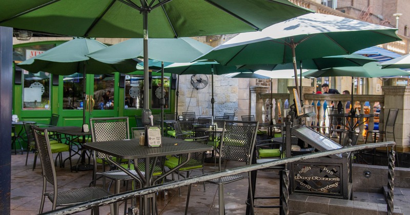 Patio, tables and seats with parasols