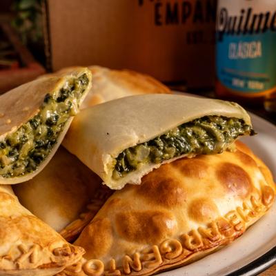 Argentine style empanadas filled with spinach and creamy cheese.