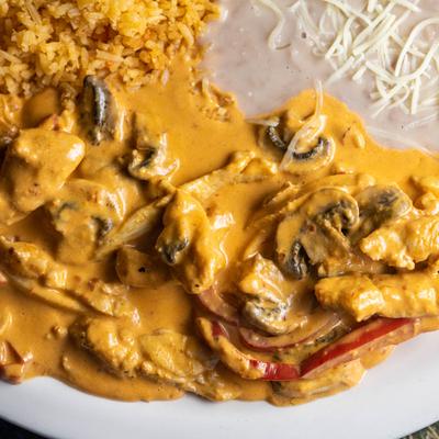 Chicken and mushroom stroganoff, with rice and beans