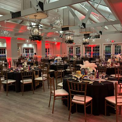 Reception space with black table linens.
