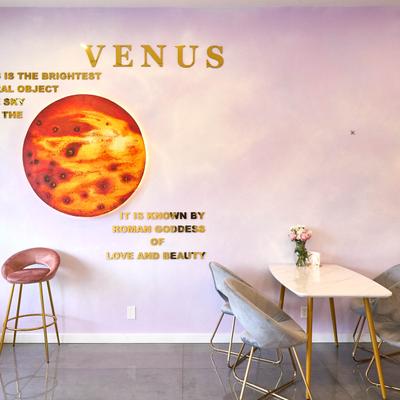 Interior, seating area, wall mural of planet Venus.