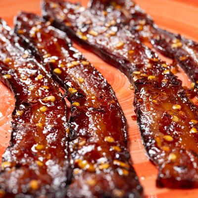 A breakfast side of crispy, spicy bacon strips.